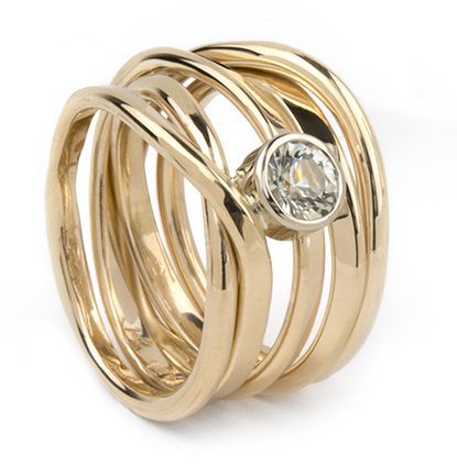 Again 14k, this ring has a almost colourless sapphire; size 6.5 and $2,640