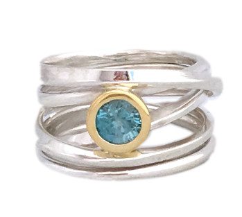 This sterling onefooter ring with a sparkling natural blue zircon set in 18k yellow gold bezel recently arrived at Human Arts Gallery in Ojai, California