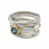 Onefooter ring, sterling silver, Size 7, with 5mm round blue zircon, set in 18k yellow gold bezel.