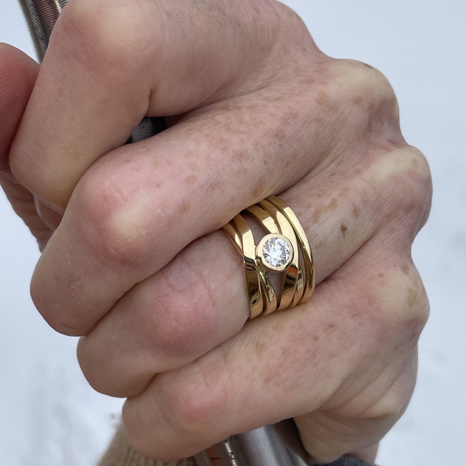 #349 Dorothee Rosen Handmade Onefooter Ring with 0.58ct Diamond in 18K Yellow Gold size 7 engagement ring on hand model