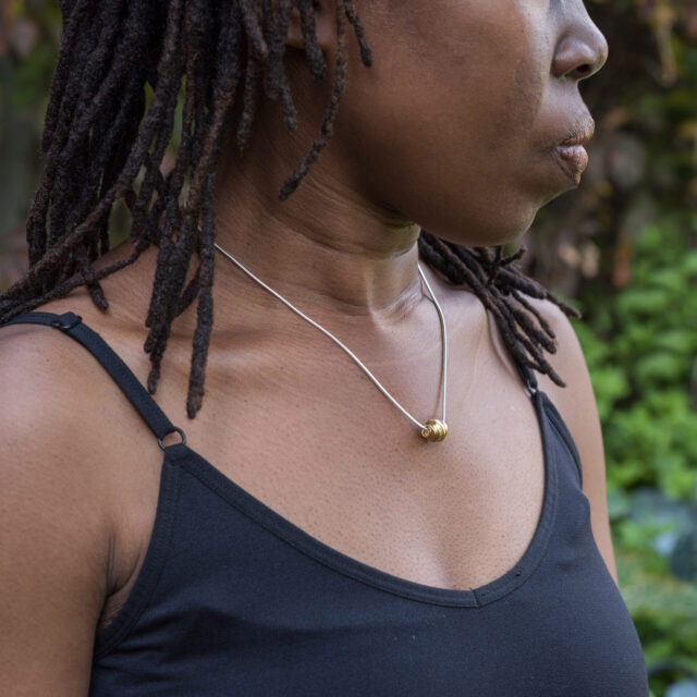 DorotheeRosen 18k Gold Onefooter necklace on model